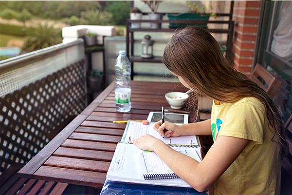 lady writing on a notebook