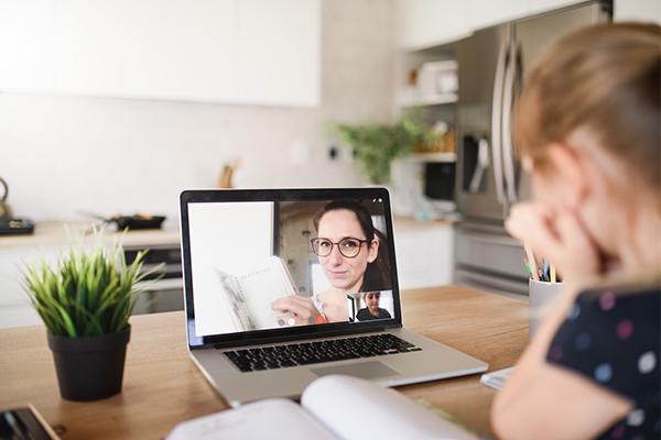Video call between mother and daughter using a laptop