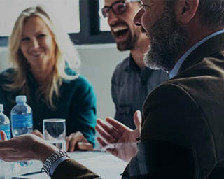 People discussing and smiling